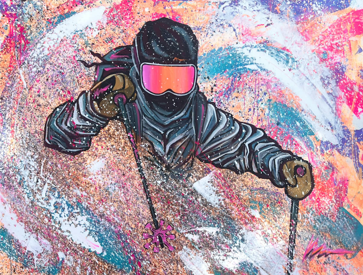 Party Zone: A skier in a dark jacket and pink goggles charging forward through a field of pastel splatter.