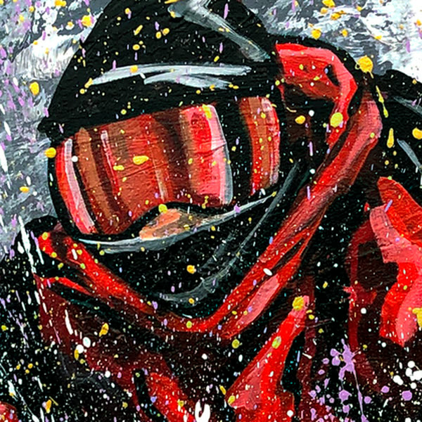 Close-up of Perfect Landing: the goggles and hood outlined in dark lines, flecked with yellow and white splatter.